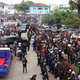 People gather outside a church during Wemba’s funeral. (AP Photo/John Bompengo)